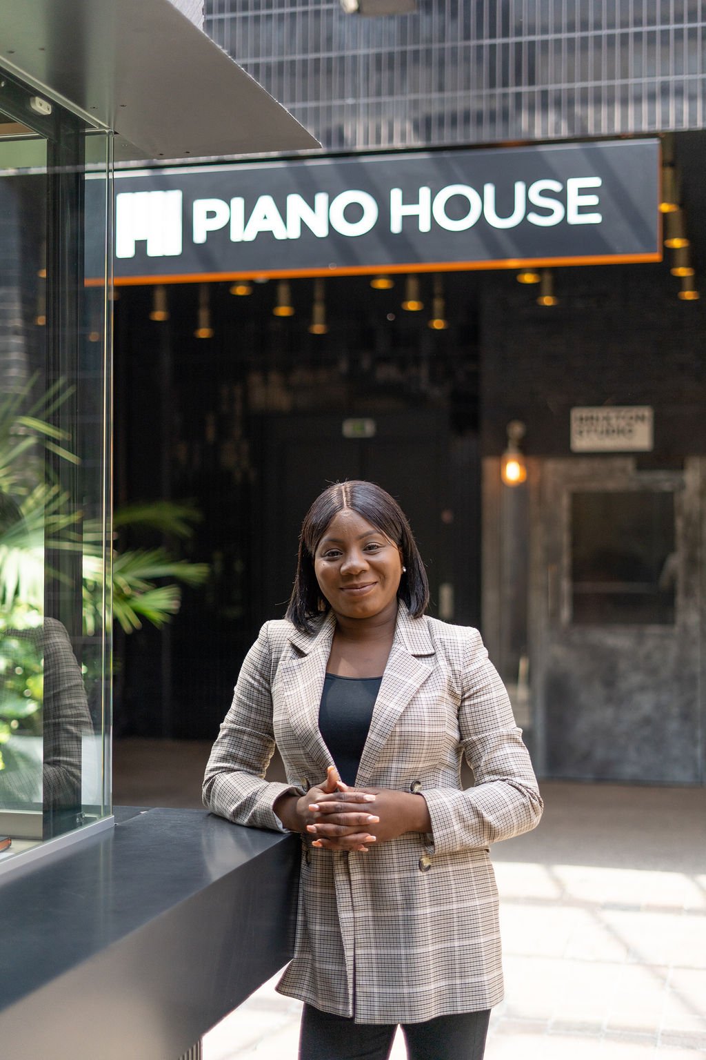 TCN Piano House Brixton Campus Manager Mel Johnson Standing in Entrance