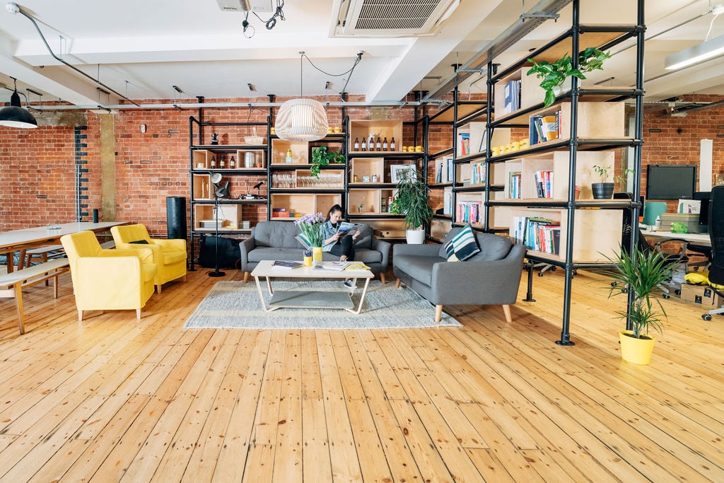 TCN Piano House Brixton Member Office Space With Person Sat On Sofa
