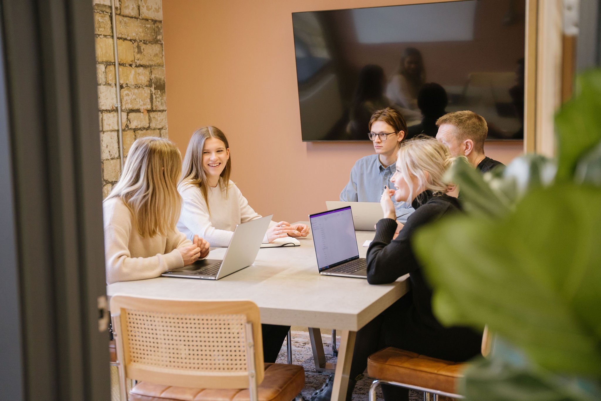 Group of members sat around a meeting room table at Newark Works office space in Bath