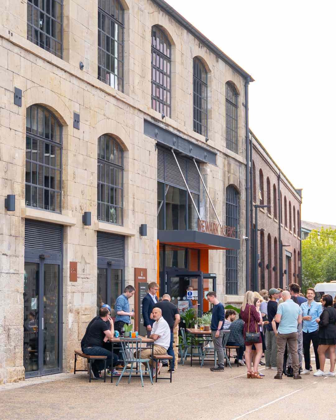 People gathered at a community event at Newark Works in Bath